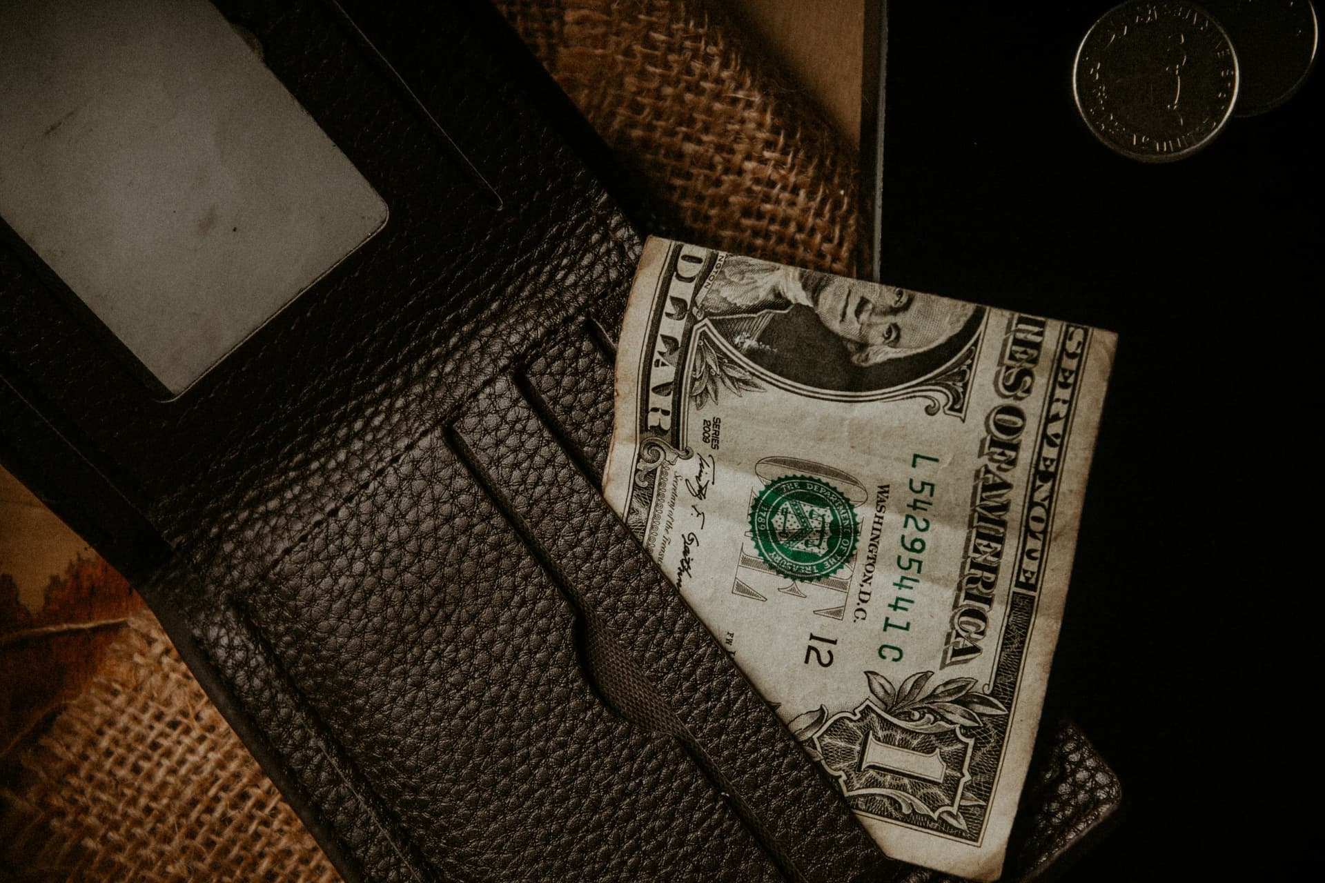 A worn full-grain leather wallet developing a patina